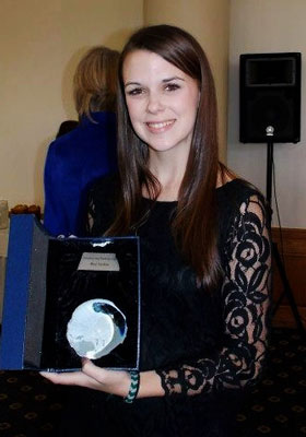 Macy Stockton \'12 holding her AFP award